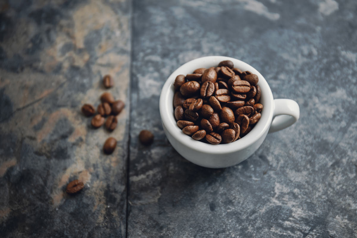 coffee beans cup stone background